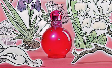 Frasco rojo de Star Shine Perfume con flores