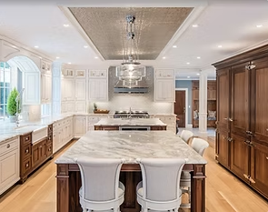 luxery custom made kitchen made by kwooddesigns with lot of drawers and countertop with island 