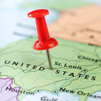 a pin on a map with usa map around the pin