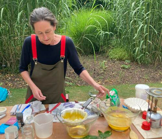 Artist Jules Bishop experimenting with supernatant, the waste from making lake pigments