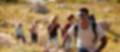Group of young adults hiking in Colorado's beautiful landscape and pursuing health