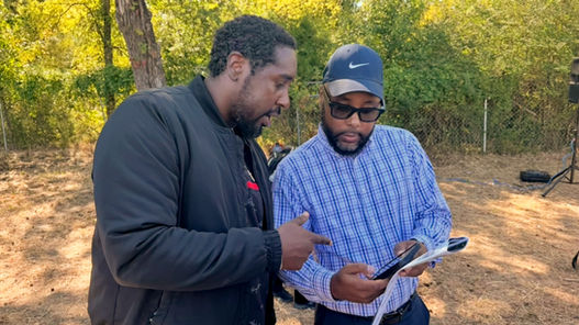 DJ at an event with his brother