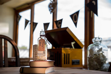 'Dream in a bottle', books, vintage record player, 'GO' banners.