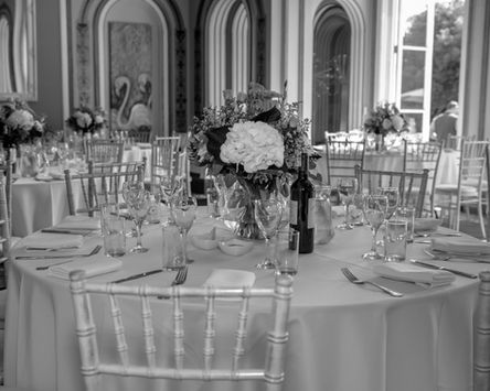 Elegant event table with floral centerpiece photographed by reliable event photographer.