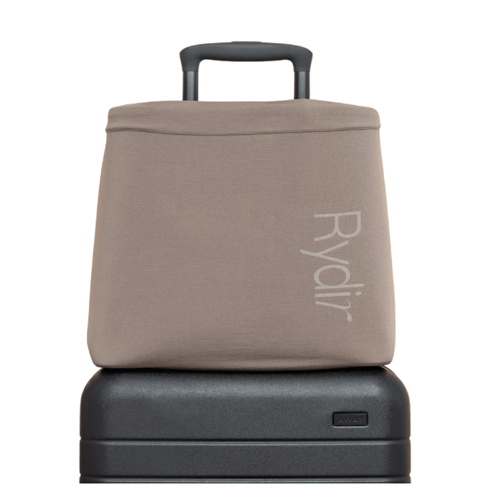 Rydir lightweight band solves big problems and adds no bulk. The Rydir Band hugs your tote to your carry-on, keeping you streamlined on your travel day.