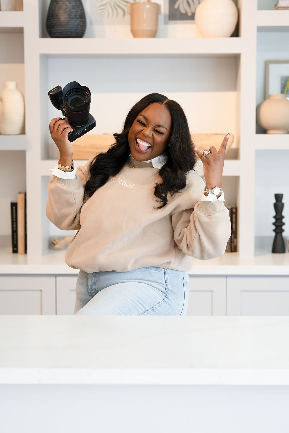 founder Carli LeBlanc smiling holding camera 