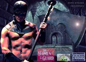 Seph Stanek dons a leather hood and a giant axe as the Headsman in The Yeomen of the Guard