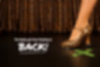 A leopard print curtain touches the black stage in the background while a lone foot wearing a tap heel (in sequined leopard print) points to a green X taped to the stage that says, "Miss Fines, Act I" - the copy reads, "The flashy girl from Flushing is back!"