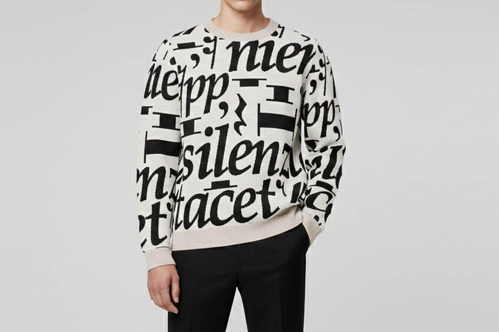Ivory jacquard-knit musical rest sweater featuring woven music notation, worn by model