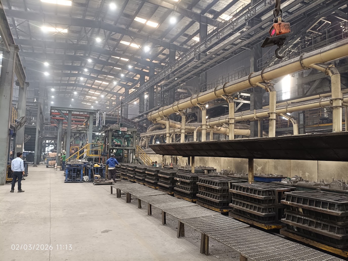 Moulding machine and mould handling system inside a foundry, seen from above