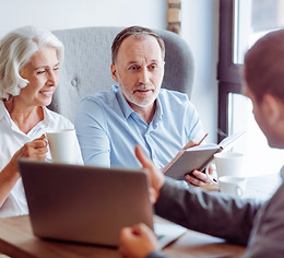 Social media post encouraging funeral pre-planning, featuring a business discussion setting.