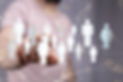 Person interacting with a digital network of people icons, representing social media engagement for funeral home marketing.