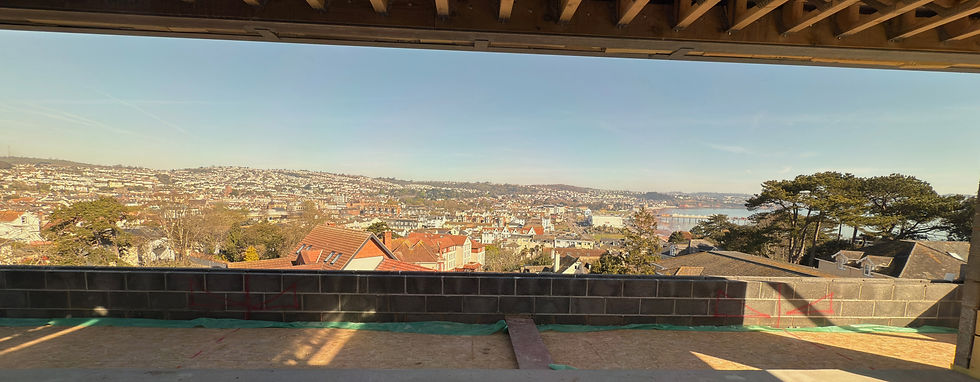 Panoramic view of Torbay from apartment interior leading to external terrace