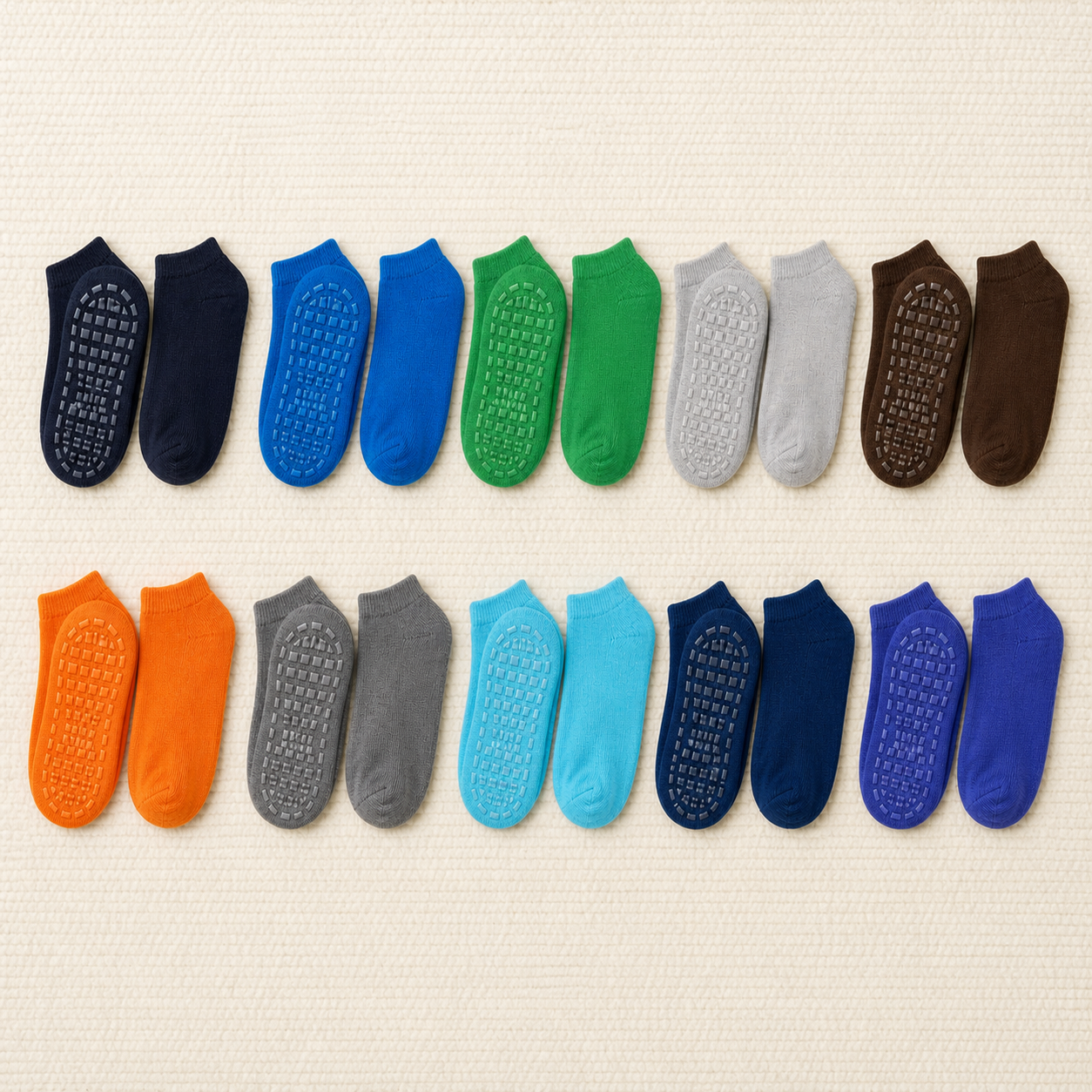 Exactly ten pairs of solid-colour children's anti-slip ankle socks arranged in two rows