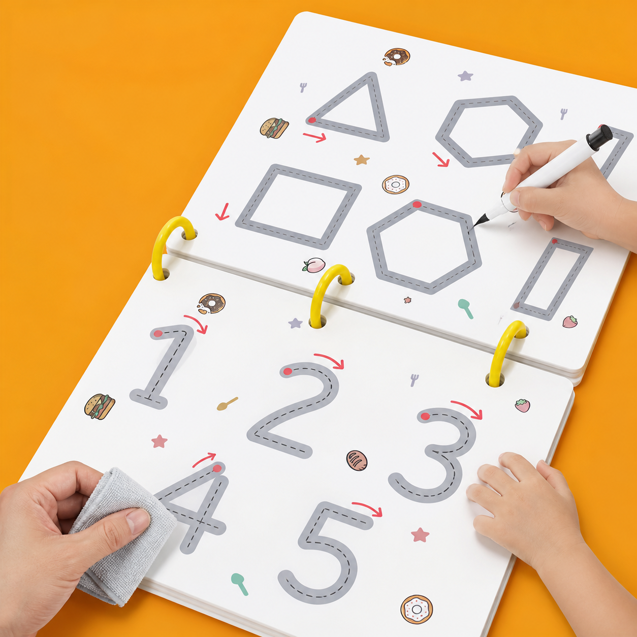 Parent and child using an erasable practice workbook together at a table