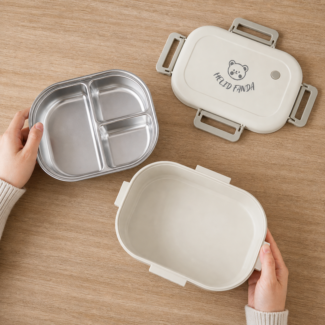 Overhead view of the removable three-compartment insert, plastic base and latched lid separated for cleaning.