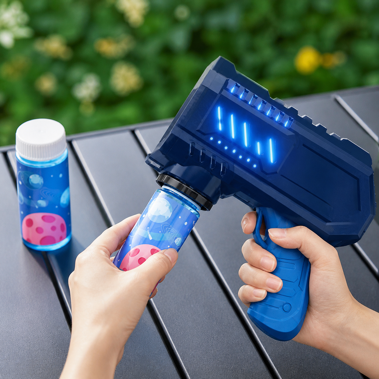 Adult attaching the solution reservoir to a dark blue automatic bubble gun