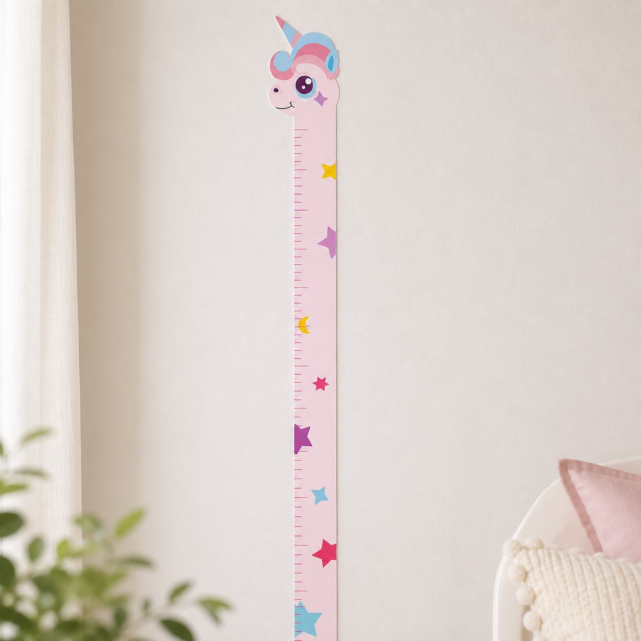 Unicorn growth chart decal installed vertically on a clean nursery wall