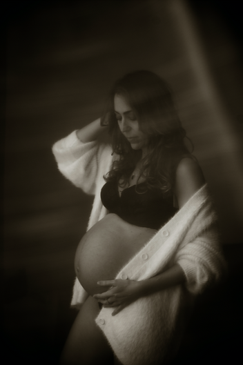 Black and white blurred image of pregnant woman