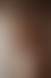 New mother holds her newborn baby in beautiful dress