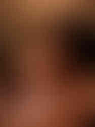 Mother and daughter embracing with eyes closed in beautiful old fashioned dresses