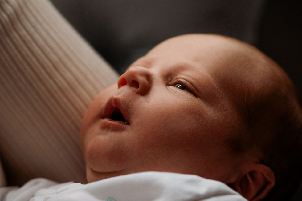 Newborn baby in mothers arms