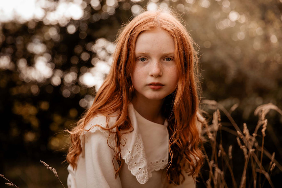 Girl with beautiful auburn red hair in old fashioned collar top