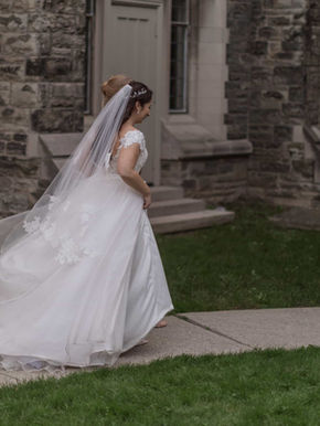 Wedding ceremony in progress at the altar of Trinity College Chapel, featuring the historic pipe organ and Gothic windows.