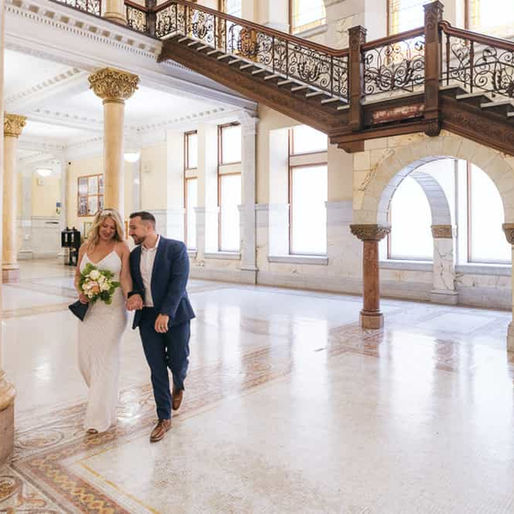 Toronto Old City Hall Wedding Couple Leaving the lobby