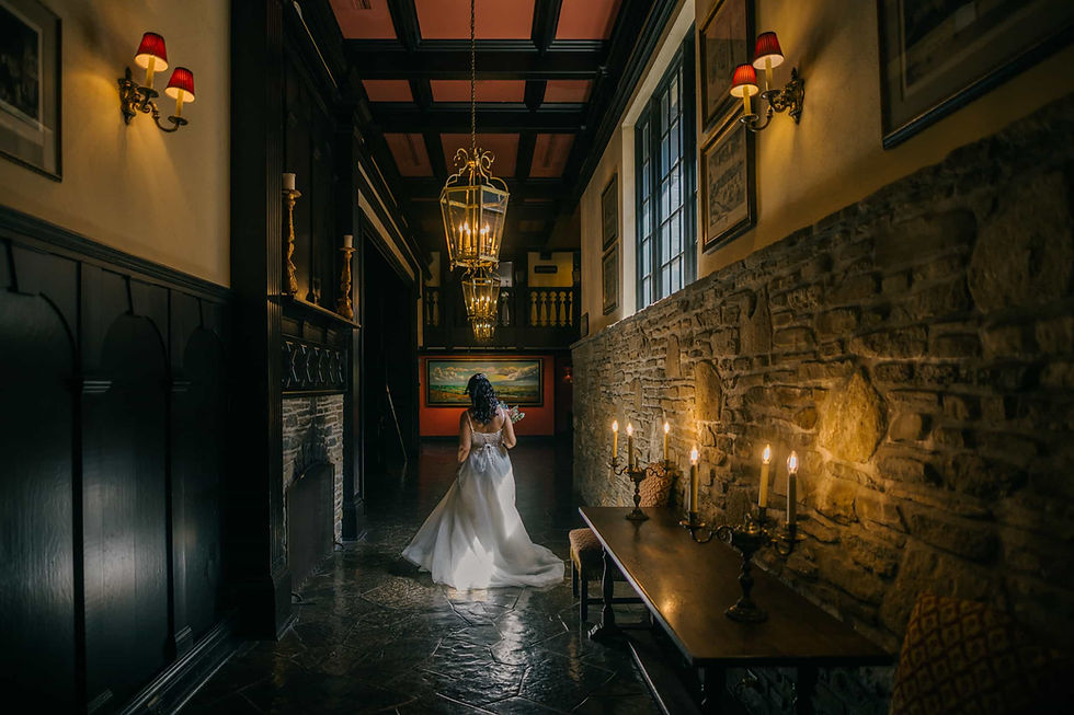Old Mill Toronto wedding photography featuring romantic, low-light portraits inside the historic stone archways.