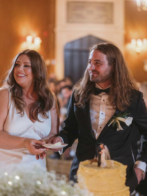 Candid cake cutting moment during a warm, intimate reception in an Old Mill private dining room