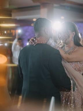  Moody and artistic wedding photography of a couple dancing, captured with soft-focus light effects at a Toronto venue.