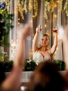 Joyful bride toast during an high-energy wedding reception at Steam Whistle Brewing in downtown Toronto.
