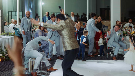 Wedding Dance Floor Candid photo of a lively Toronto wedding reception dance floor with the groom being lifted in the air by guests.