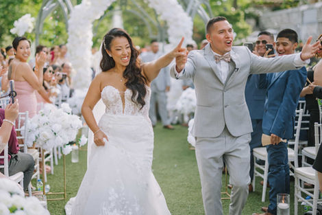 A romantic forest wedding ceremony in Toronto with the couple standing at the altar surrounded by tall trees.