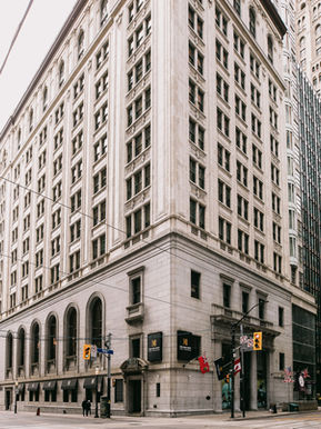 The historic Beaux-Arts skyscraper architecture of One King West Hotel & Residence at the corner of King and Yonge in downtown Toronto.