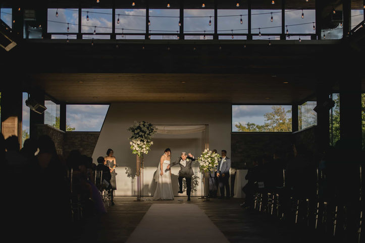 groom celebrating after smashing traditional glass