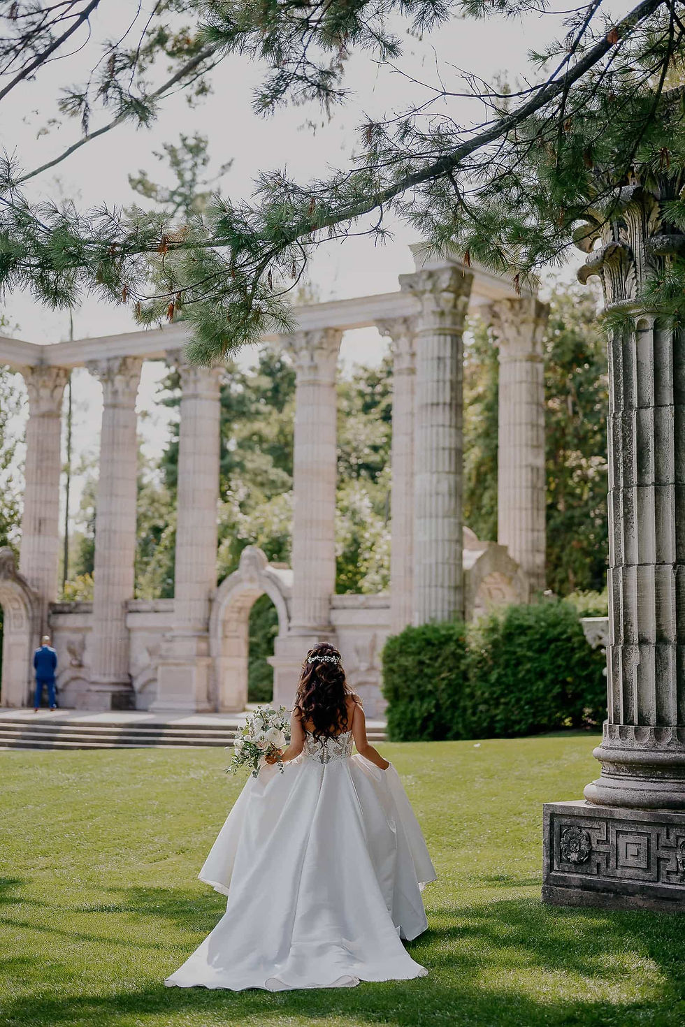 Bride walking away from camera in a white dress, stunning background, Toronto wedding photographer