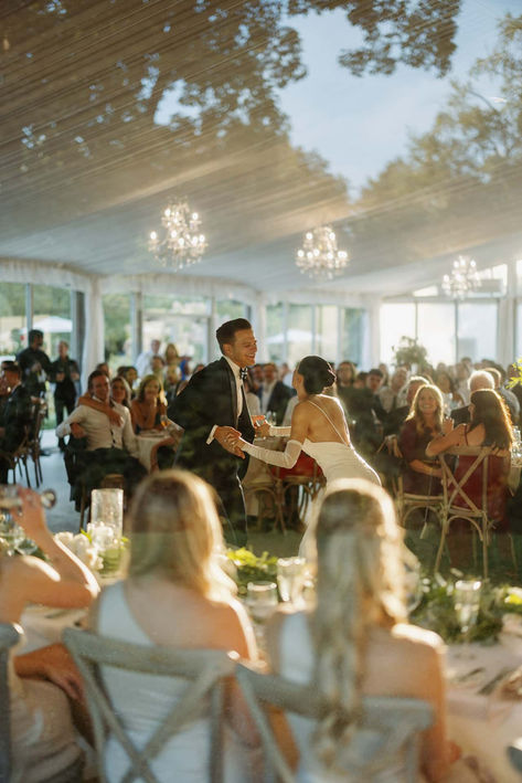 Lively outdoor wedding reception with guests mingling under string lights, expertly photographed by a GTA wedding photographer
