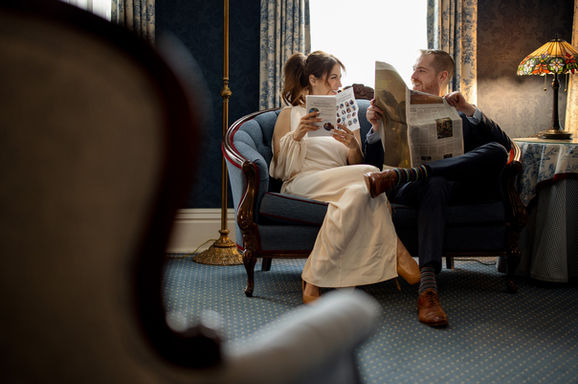 A candid, warm indoor shot of the bride getting ready, with family or friends nearby, highlighting the intimate moments of a Niagara wedding day.