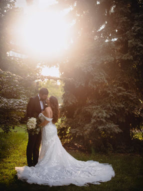 Romantic sunset silhouette of a wedding couple during their golden hour portrait session on the Liberty Grand grounds.