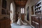 bride waiting to walk into Trinity College Chapel during ceremony