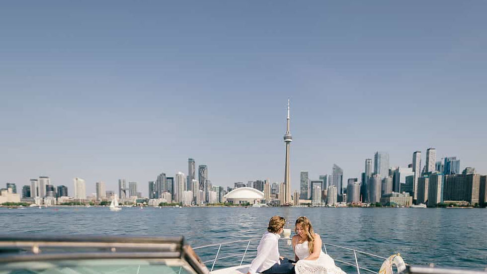 couple enjoying a boat ride overlooking the Toronto skyline