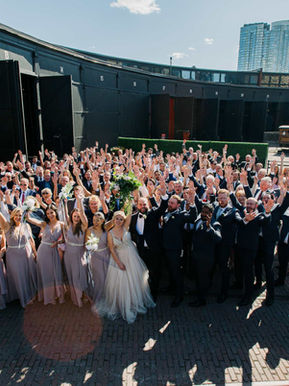  Large group wedding photo on the historic train turntable outside Steam Whistle Brewing in Roundhouse Park.