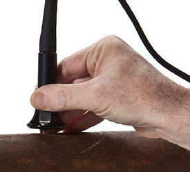 Hand holding Olympus D790-SM ultrasonic transducer.JPG