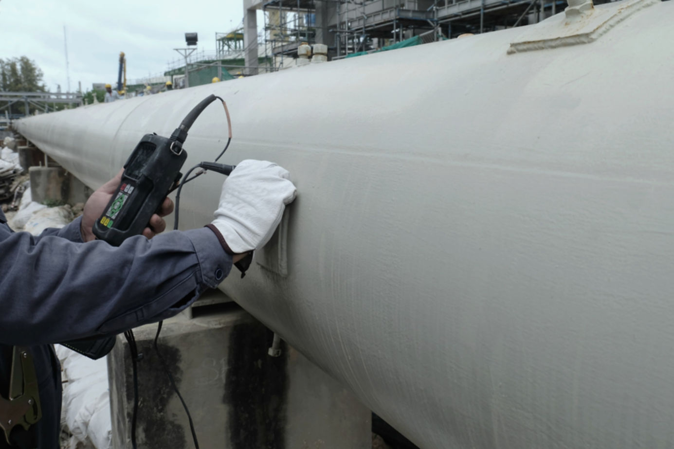 Close up shot of Ultrasonic thickness technician inspector looking at scale on monitor pip