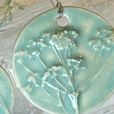 Thumbnail: Large Round Pacific Blue Embossed Tree Pendant Necklace