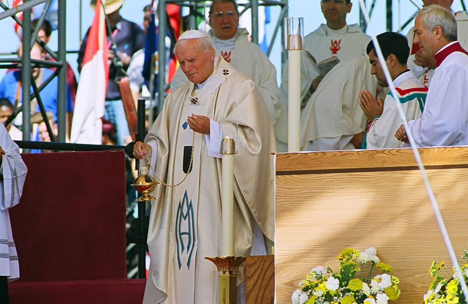 A white sun symbolizing the Holy Spirit against a blue to yellow gradient, representing hope.