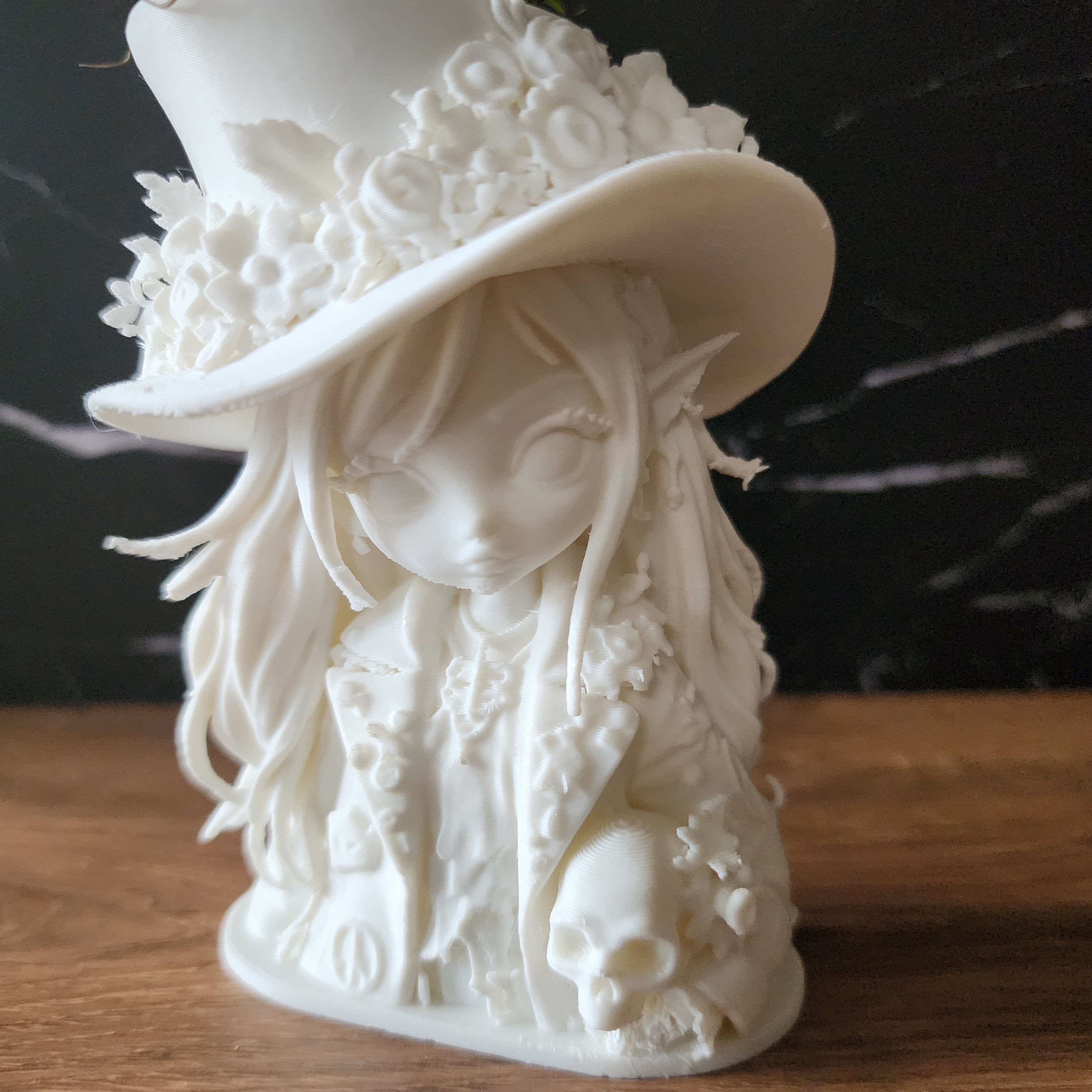 Wildflower Wren 4 inch white Bloom Relic holding a skull with living air plant