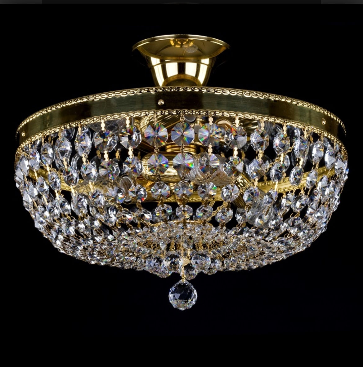 The Gerta basket chandelier featuring 30% PbO crystal chains, a brass ornate frame & a mirror finish inner metal plate.